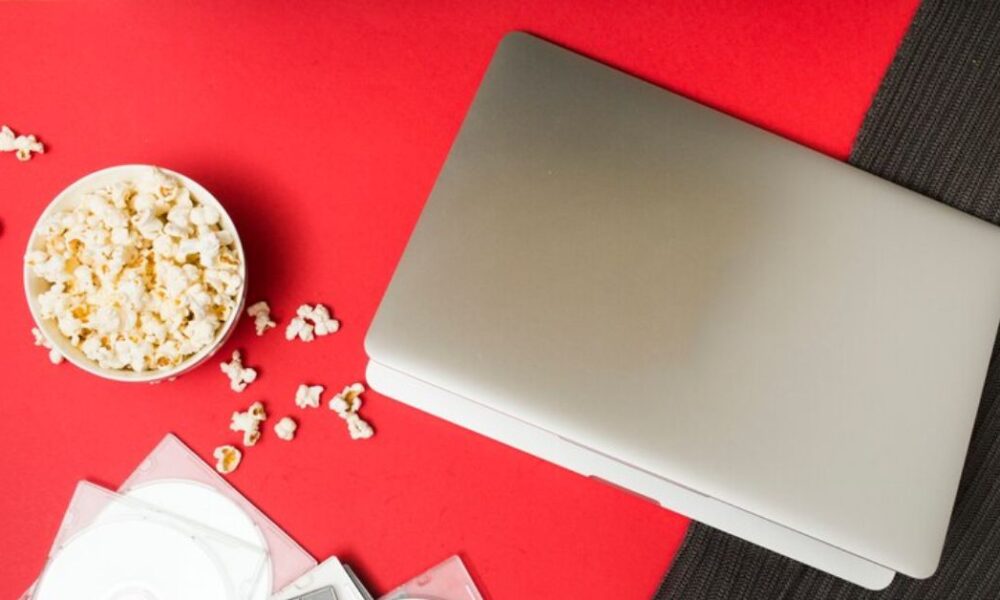 How can you download movies on your MacBook?